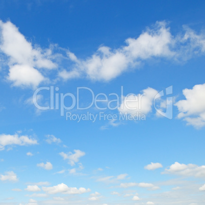 white cumulus clouds against the blue sky