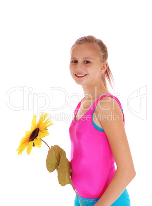 Young girl standing in bathing suit.