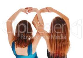 Two girls with there hands up.