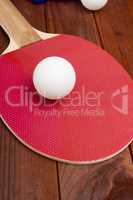 Ball ping pong on a tennis racket