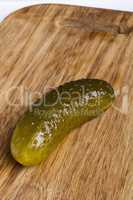 Pickled cucumbers on a kitchen cutting board