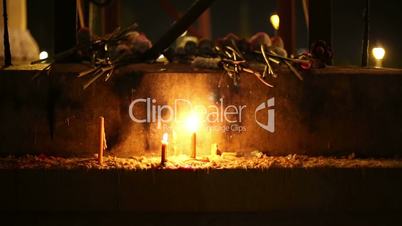 Beautiful candles burning in buddhist shrine, Phnom Penh, Cambodia
