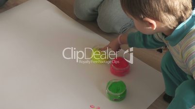 children paint finger paints