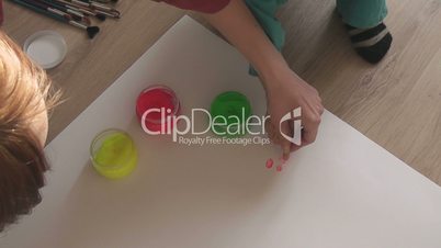 children paint finger paints