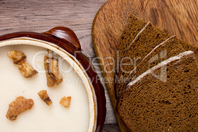 Melted fat and brown bread on chopping board