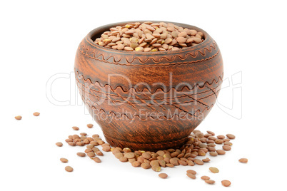 lentils in a clay pot isolated on white background