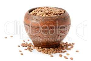 lentils in a clay pot isolated on white background