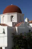 Traditional church in Greece with red domes