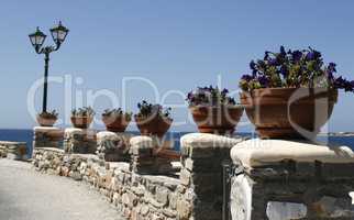 beautiful promenade decorated with flowers on an island in Greece