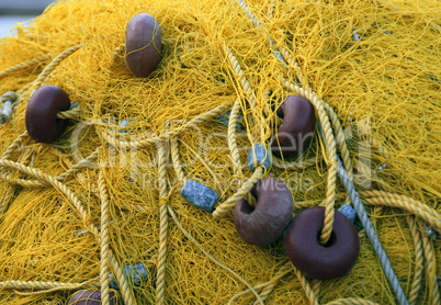 Fishnets on fish boat. Yellow net. Greece