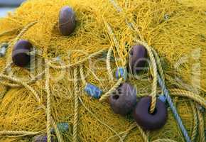 Fishnets on fish boat. Yellow net. Greece