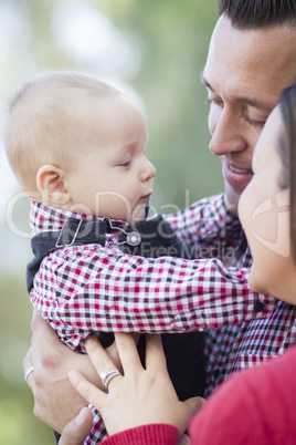 Little Baby Boy Having Fun With Mother and Father Outdoors