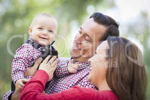 Little Baby Boy Having Fun With Mother and Father Outdoors