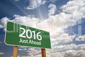 2016 Just Ahead Green Road Sign Against Clouds