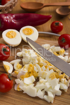 Kitchen board with finely chopped eggs