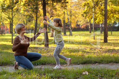little girl running to embrace mother