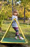 beautiful little girl posing on playground