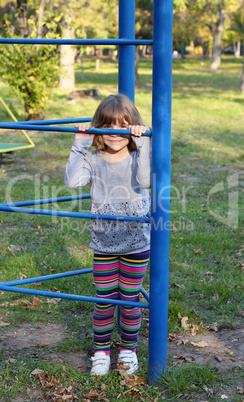 little girl hiding on playground