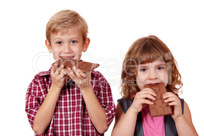 boy and little girl eating chocolate boy and little girl eating chocolate