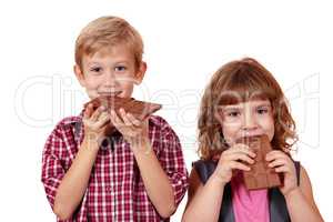 boy and little girl eating chocolate