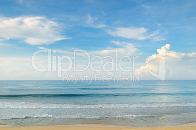 ocean, sandy beach and blue sky