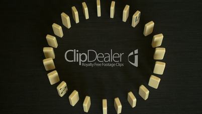 Slow motion circle domino effect in high angle shot