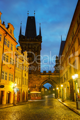 Old Prague street with Charles bridge