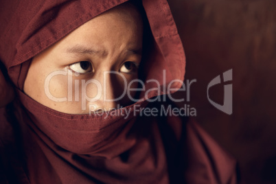 Buddhist novice monk covered with robe