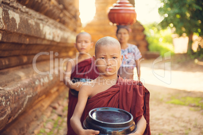 Buddhist novice monks collecting foods