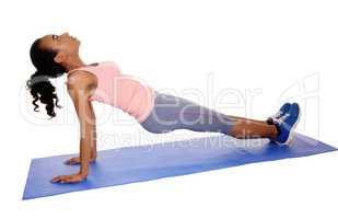 Beautiful African American woman exercising.