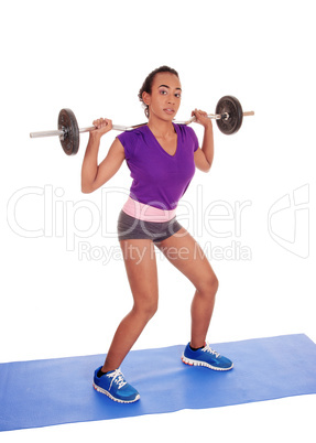 African American woman weight lifting.
