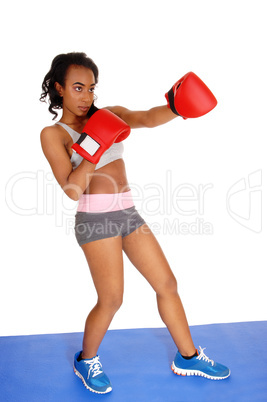 Boxer woman giving a punch.