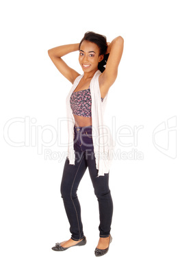 African American woman standing in jeans.