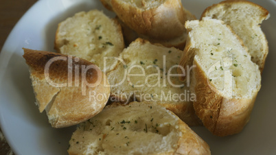 Macro from crusty garlic and herb bread
