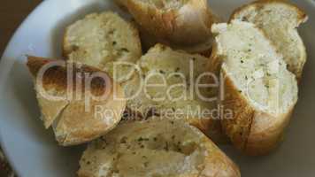 Macro from crusty garlic and herb bread