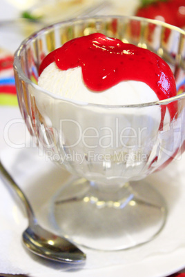 Ice cream poured raspberry syrup