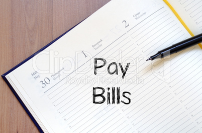 Pay bills write on notebook