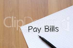 Pay bills write on notebook