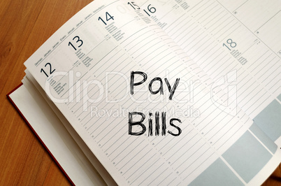 Pay bills write on notebook