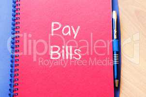 Pay bills write on notebook