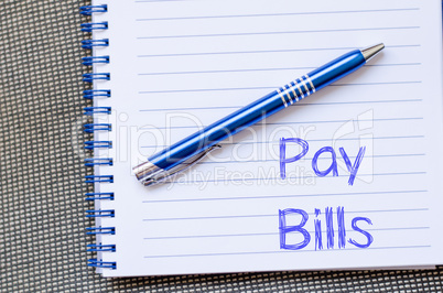 Pay bills write on notebook