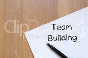 Team building write on notebook