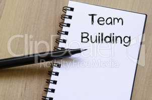 Team building write on notebook