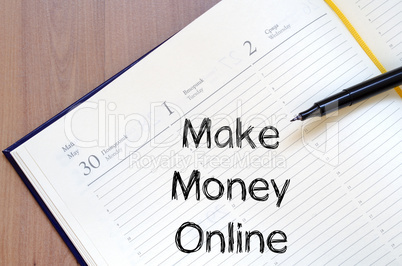Make money online write on notebook