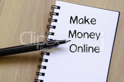 Make money online write on notebook