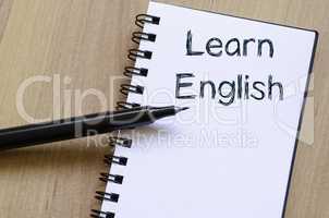 Learn english write on notebook