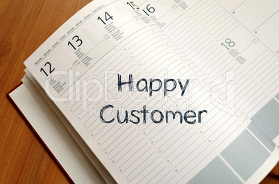 Happy customer write on notebook