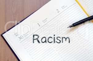 Racism write on notebook