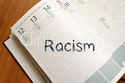 Racism write on notebook