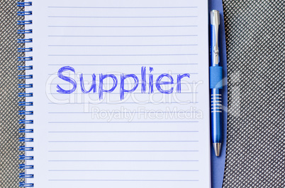 Supplier write on notebook
